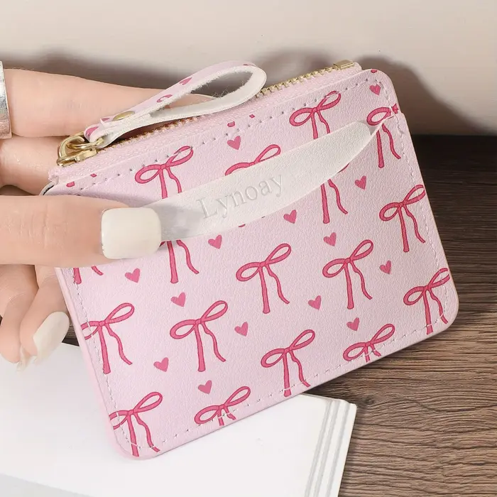 Portefeuille ultra-fin à fermeture éclair pour femme : porte-cartes rose avec nœud en forme de cœur