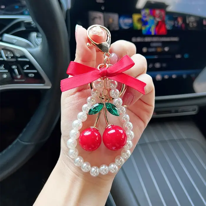 Porte-clés créatif cerise avec nœud et perles