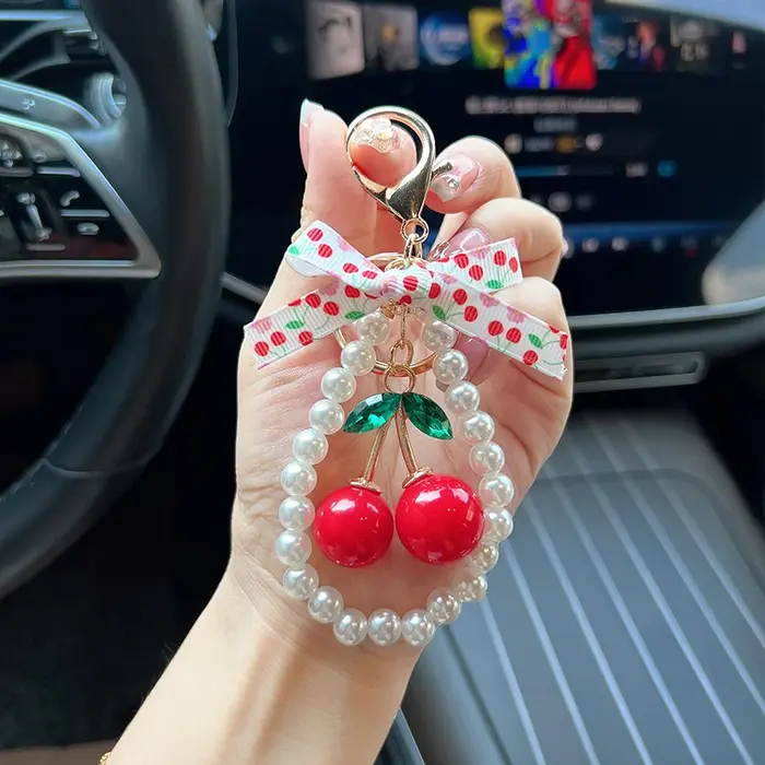 Porte-clés créatif cerise avec nœud et perles