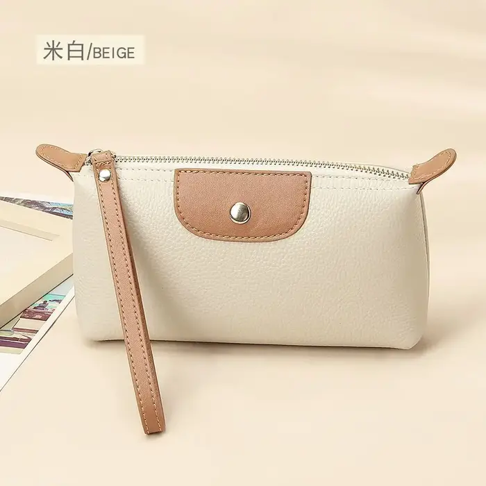 Le nouveau portefeuille pour femme en cuir souple et tendance avec des couleurs contrastées est un sac à main portable