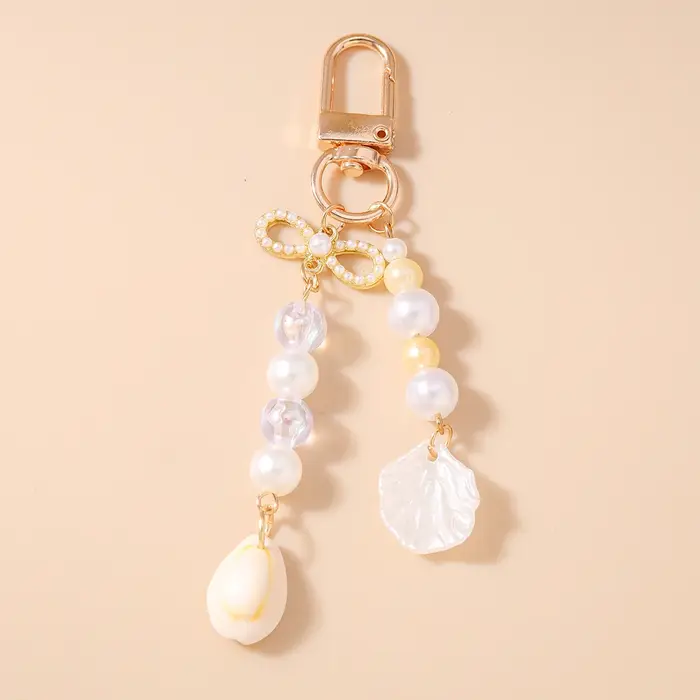 Joli porte-clés en forme de coquille de perles pour femmes et filles