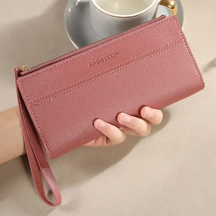 Portefeuille femme à la mode avec des couleurs contrastées ; long design à pompons ; porte-cartes mu